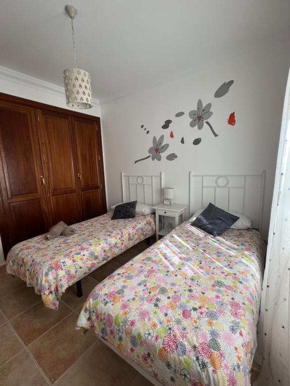 Postel nebo postele na pokoji v ubytování CasadeLanzarote