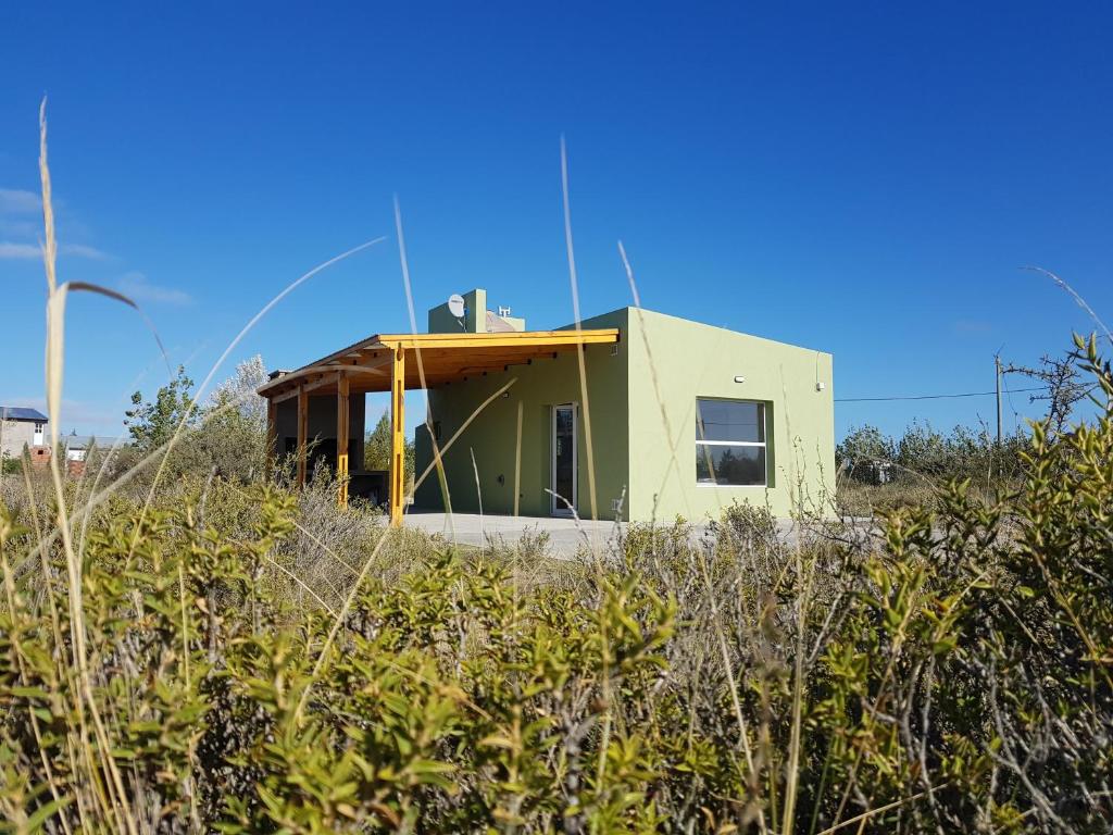 a house in the middle of a field at Coralillos in Puerto Madryn