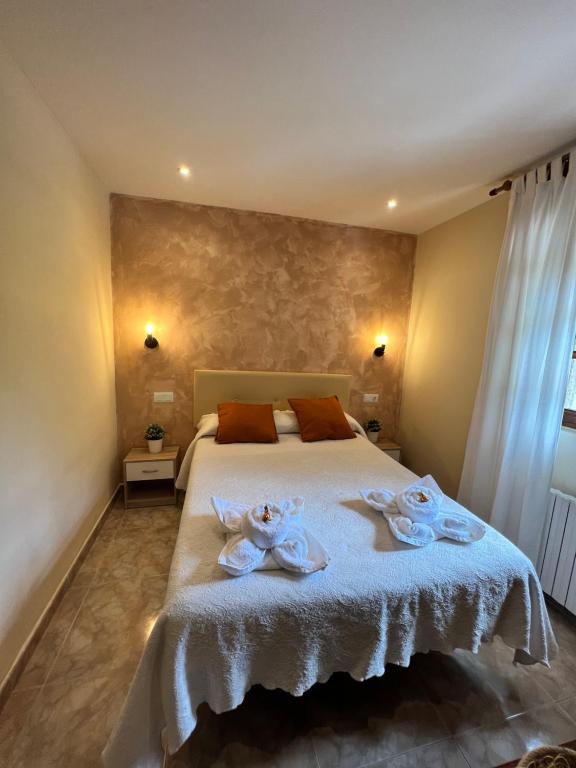 Postel nebo postele na pokoji v ubytování Hostal La Ruta