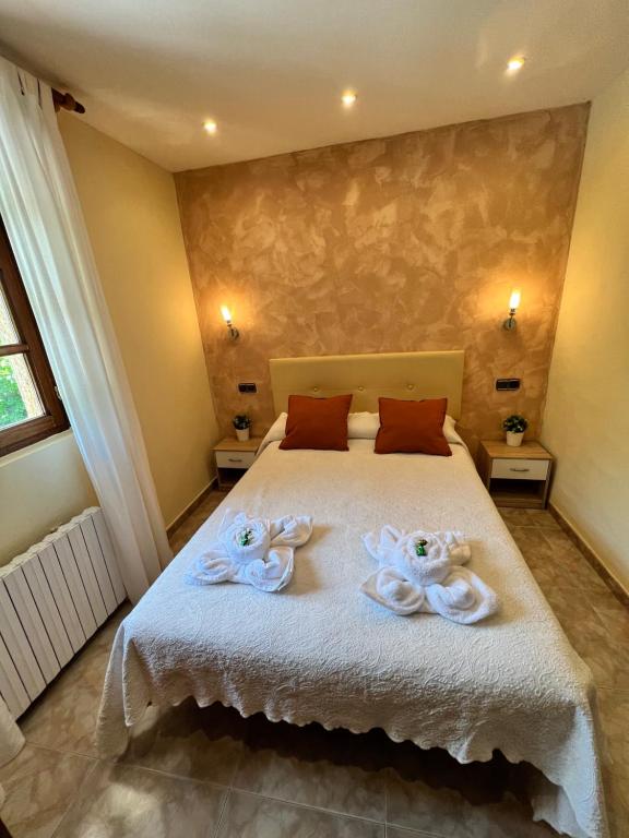 Postel nebo postele na pokoji v ubytování Hostal La Ruta