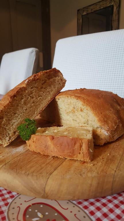 two slices of bread sitting on a cutting board at Gardenvale Manor House B&B in Stranocum