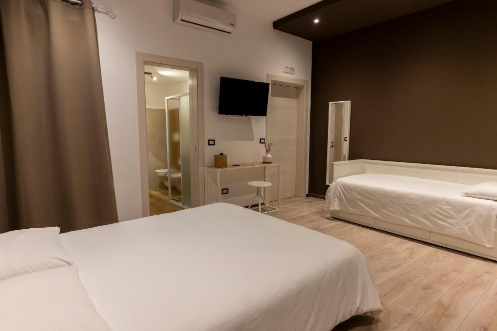 Posteľ alebo postele v izbe v ubytovaní Adrian's B&B