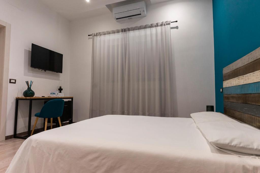 Posteľ alebo postele v izbe v ubytovaní Adrian's B&B