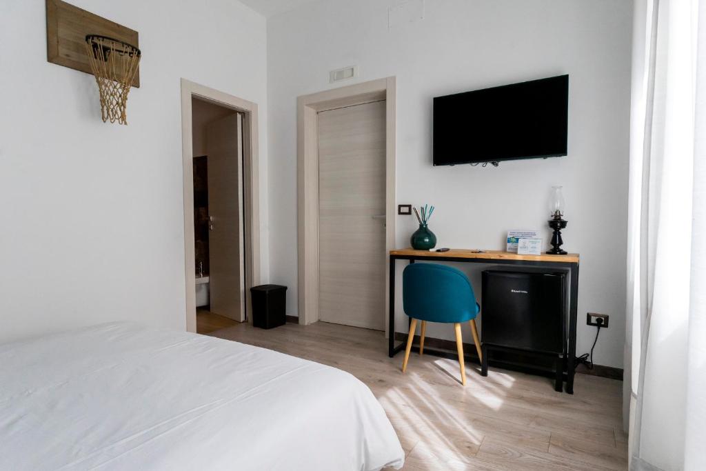 Televízia a/alebo spoločenská miestnosť v ubytovaní Adrian's B&B