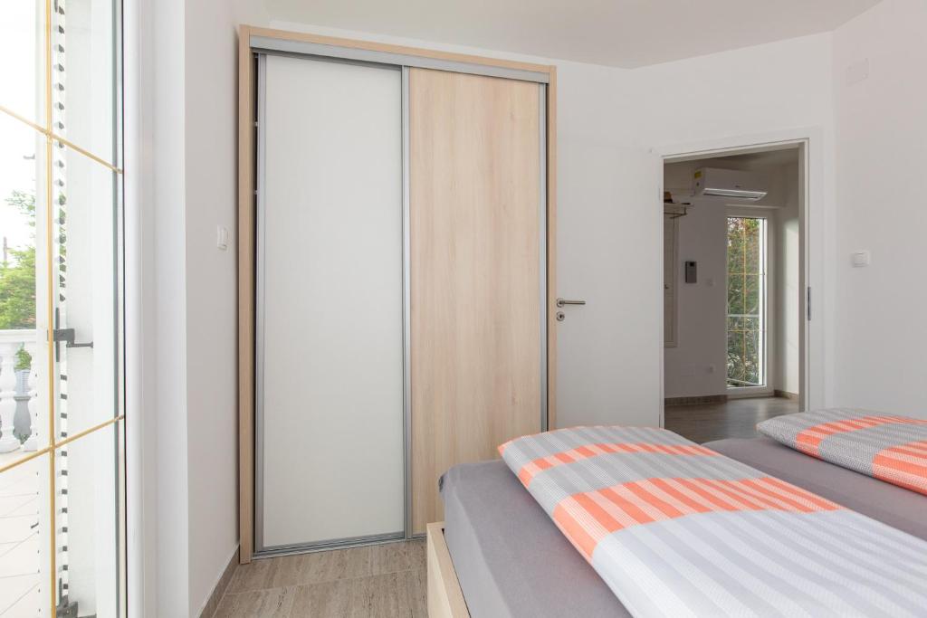 Postel nebo postele na pokoji v ubytování Ferienhaus Nikola