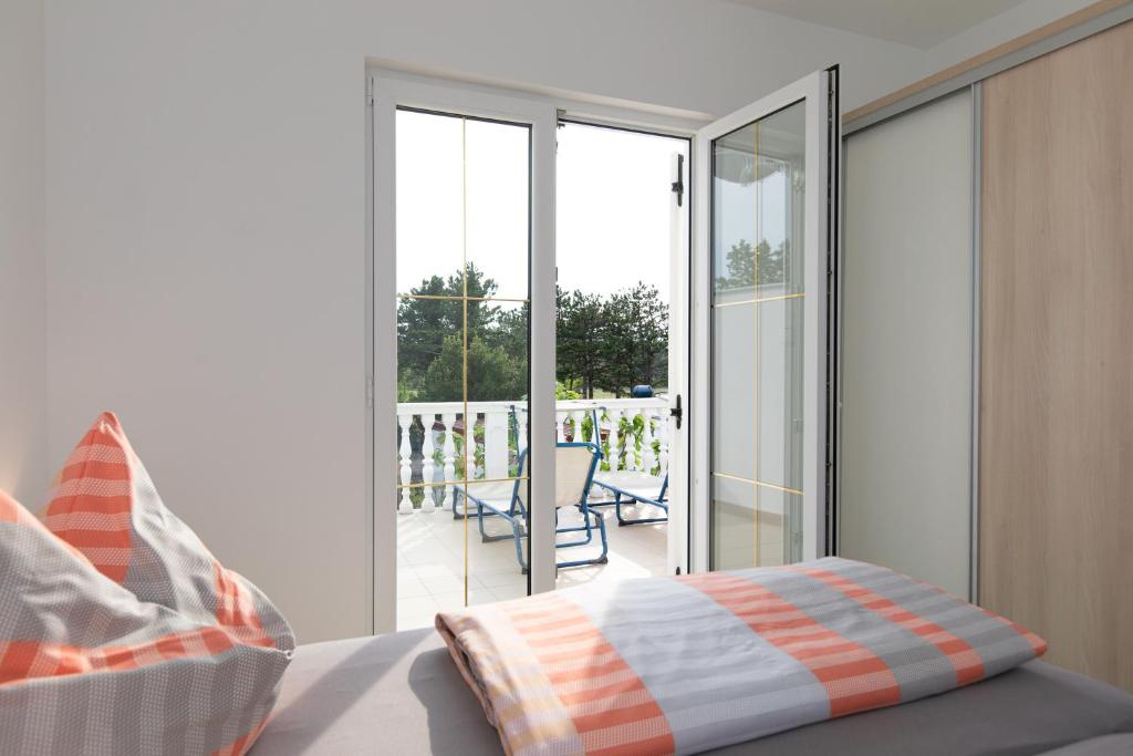 Postel nebo postele na pokoji v ubytování Ferienhaus Nikola