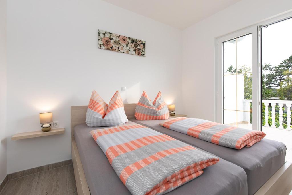 Postel nebo postele na pokoji v ubytování Ferienhaus Nikola