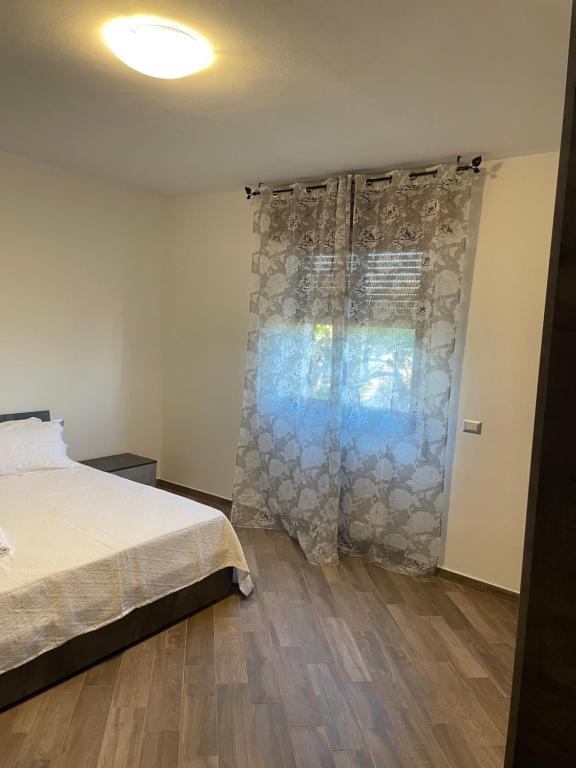 A bed or beds in a room at Villa Daniele