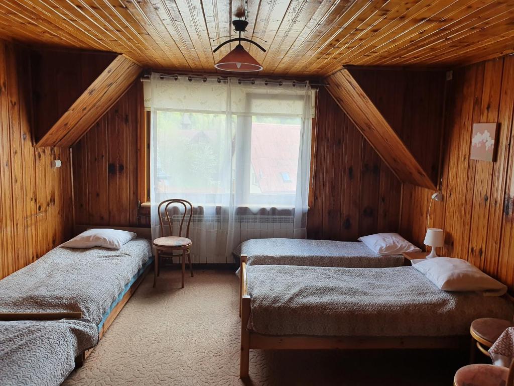 Postel nebo postele na pokoji v ubytování Willa Słotwinka