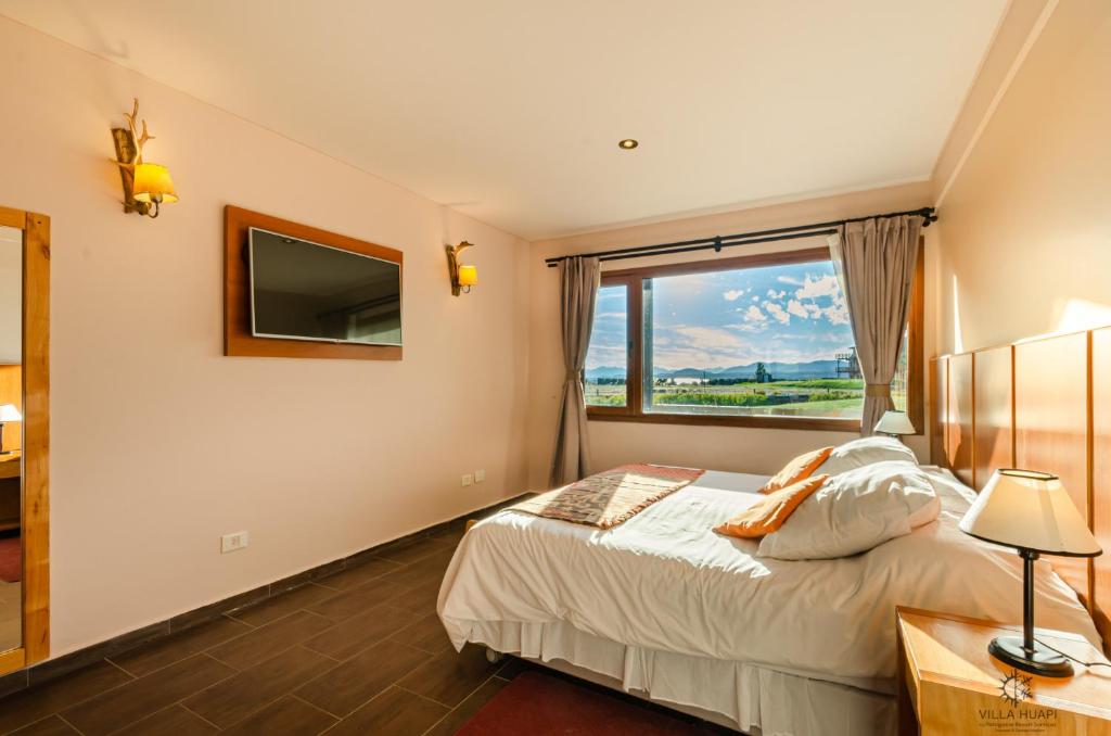 Postel nebo postele na pokoji v ubytování Villa Huapi