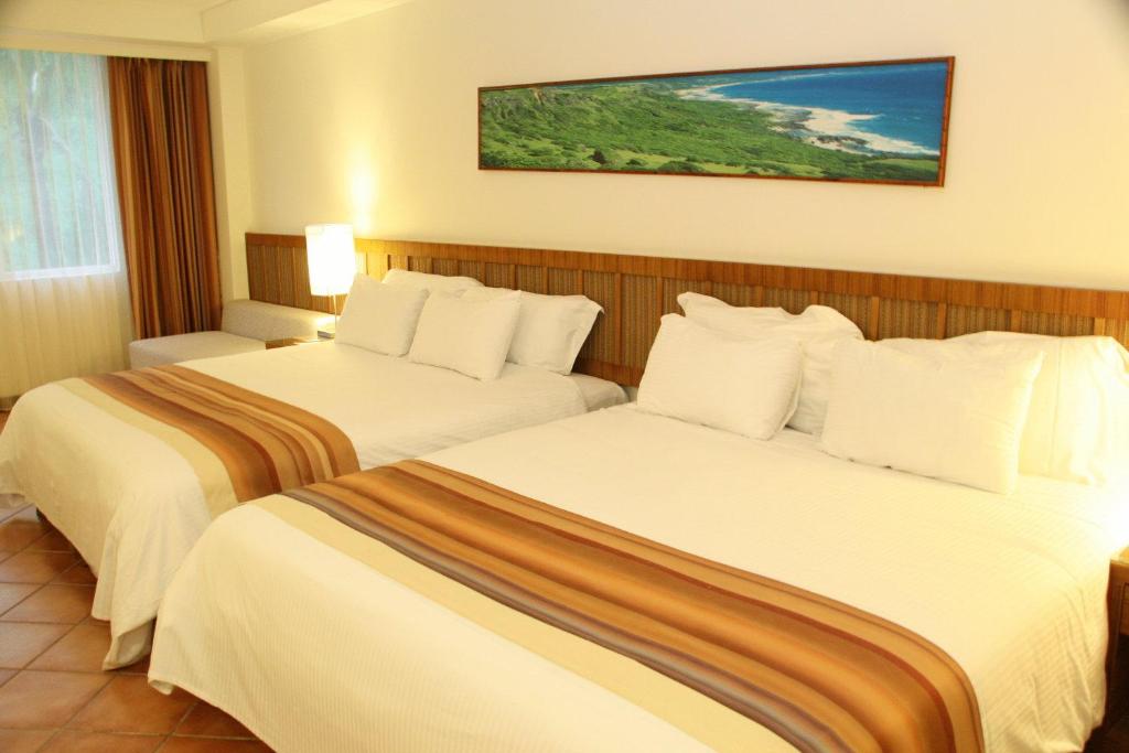 Postel nebo postele na pokoji v ubytování Fullon Resort Kending