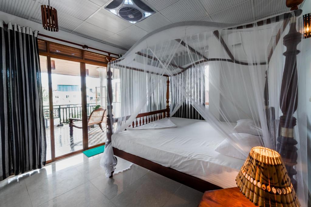 Postel nebo postele na pokoji v ubytování Seaview Deepal villa