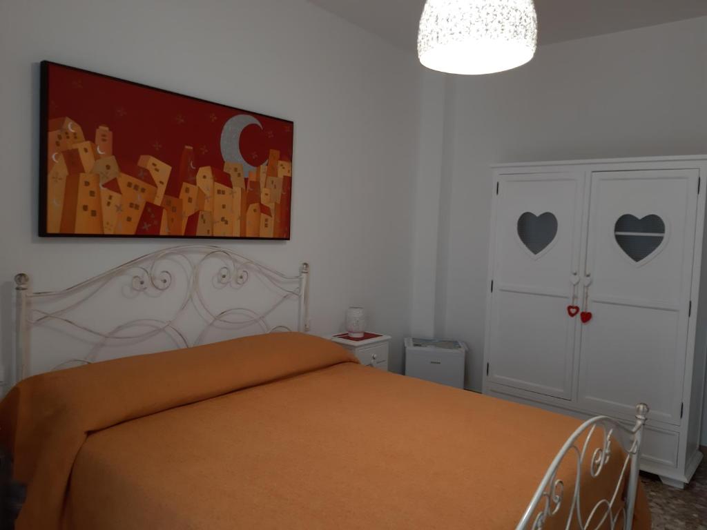 Posteľ alebo postele v izbe v ubytovaní Casa Mina affittacamere
