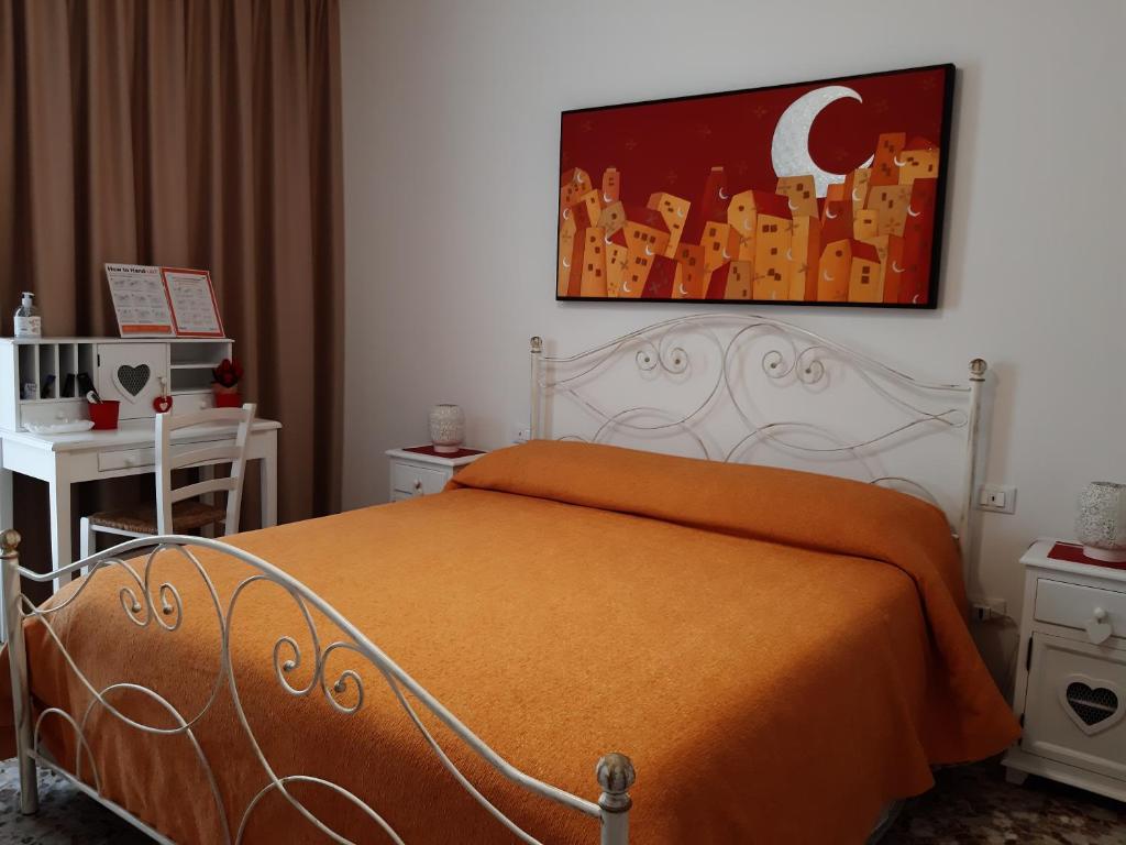 Posteľ alebo postele v izbe v ubytovaní Casa Mina affittacamere