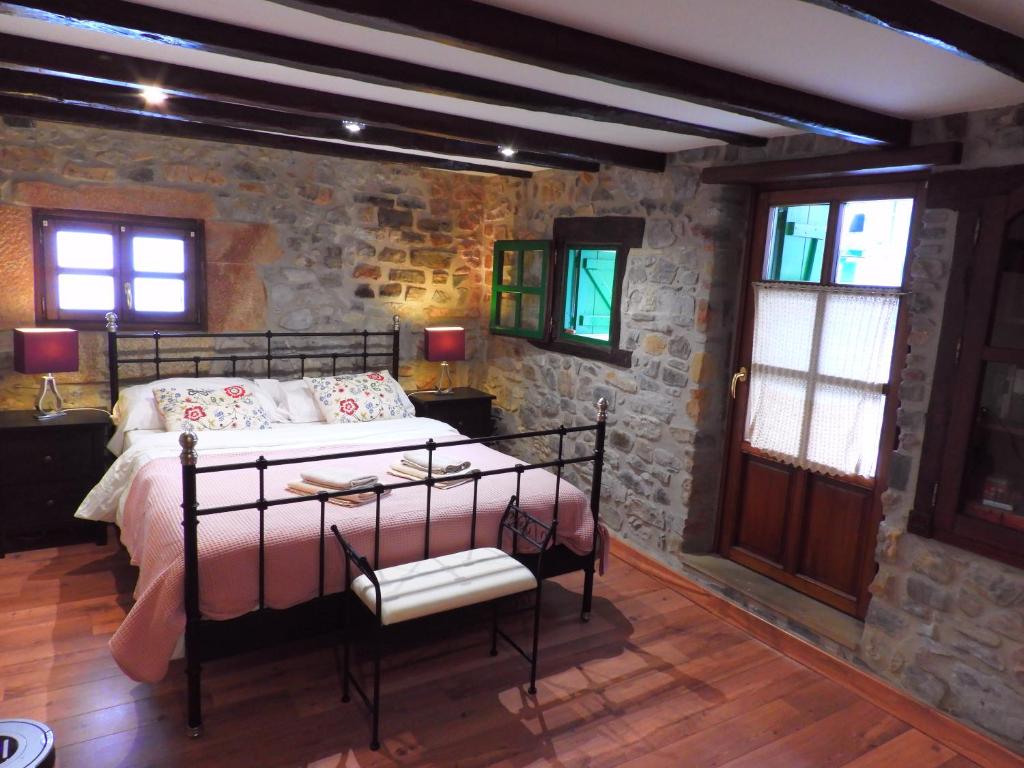 Tempat tidur dalam kamar di Mariñelarena