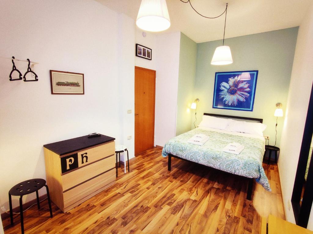 A bed or beds in a room at PH Milano