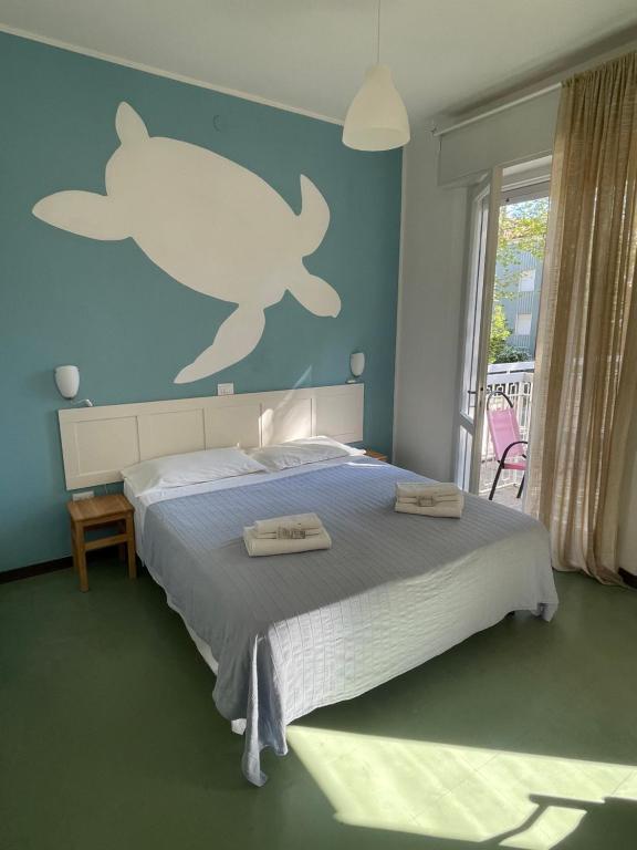 Postel nebo postele na pokoji v ubytování Hotel Aloha