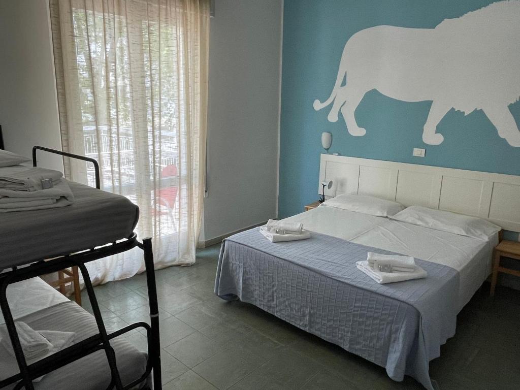 Postel nebo postele na pokoji v ubytování Hotel Aloha