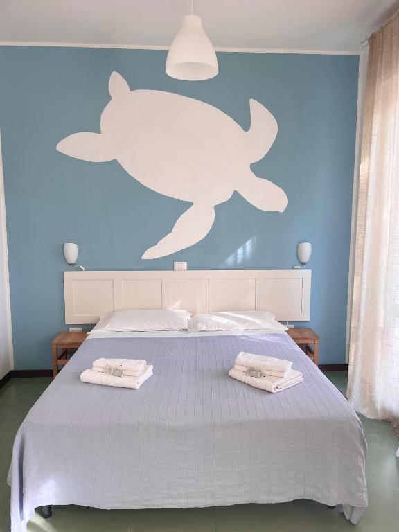 Postel nebo postele na pokoji v ubytování Hotel Aloha