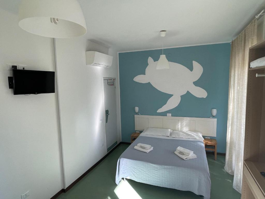 Postel nebo postele na pokoji v ubytování Hotel Aloha