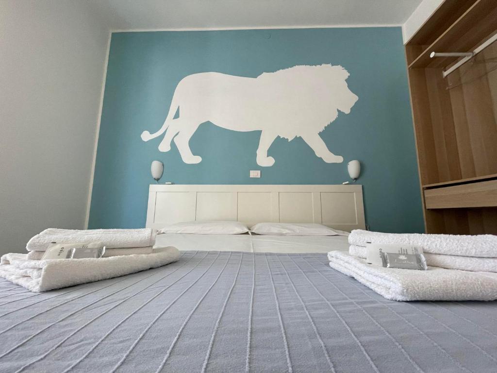 Postel nebo postele na pokoji v ubytování Hotel Aloha