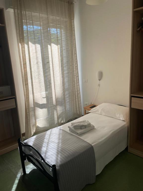 Postel nebo postele na pokoji v ubytování Hotel Aloha