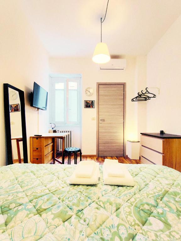 A bed or beds in a room at PH Milano