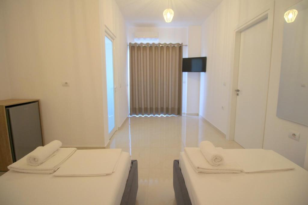 Postel nebo postele na pokoji v ubytování J&B Hotel