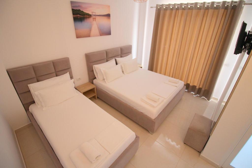 Postel nebo postele na pokoji v ubytování J&B Hotel