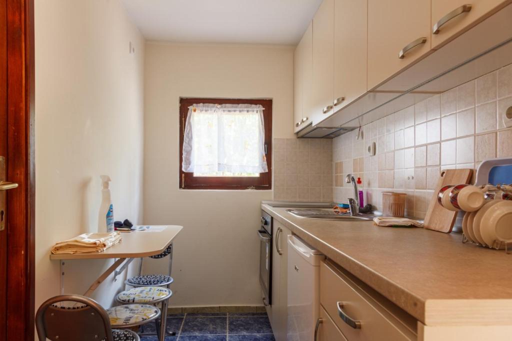 a kitchen with a sink and a counter top at Villa M in Vinci