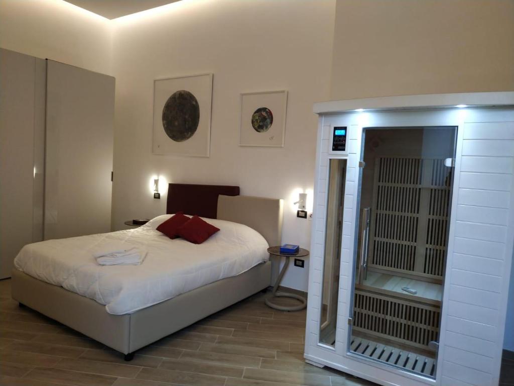 Letto o letti in una camera di Neruda Chic House Vomero