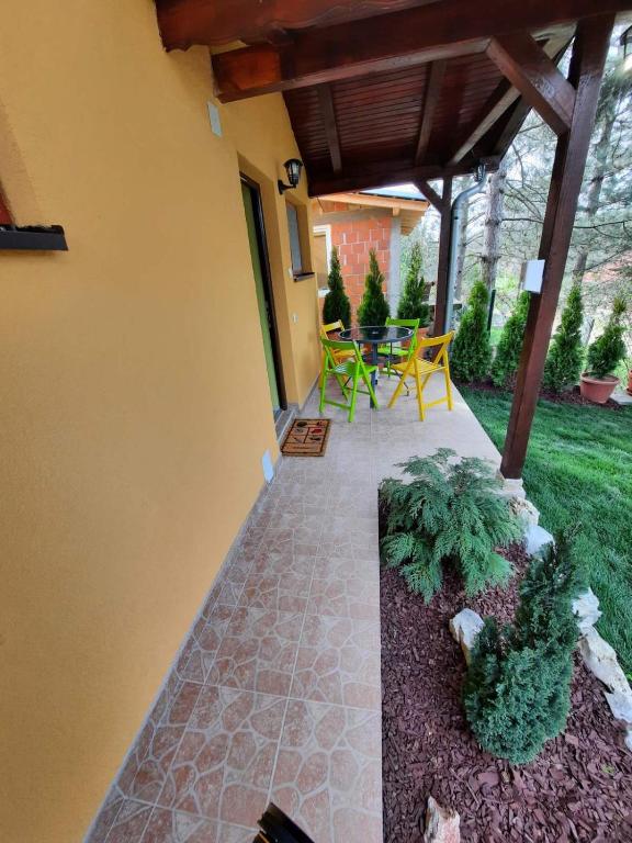 a patio with a table and chairs in a yard at Villa M in Vinci
