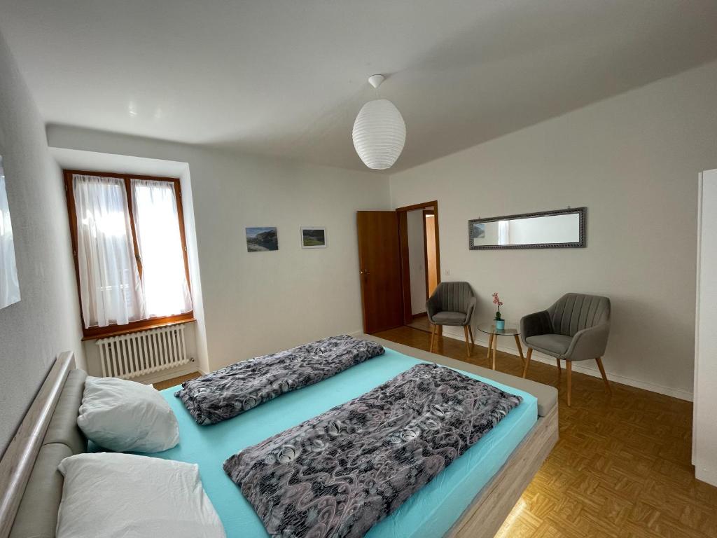 Postel nebo postele na pokoji v ubytování Residence Gaggiole, apartment 2