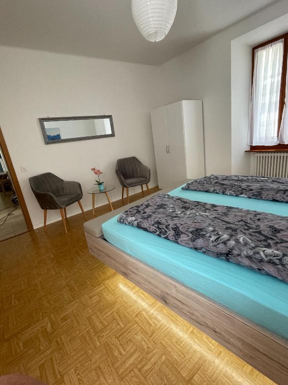 Postel nebo postele na pokoji v ubytování Residence Gaggiole, apartment 2