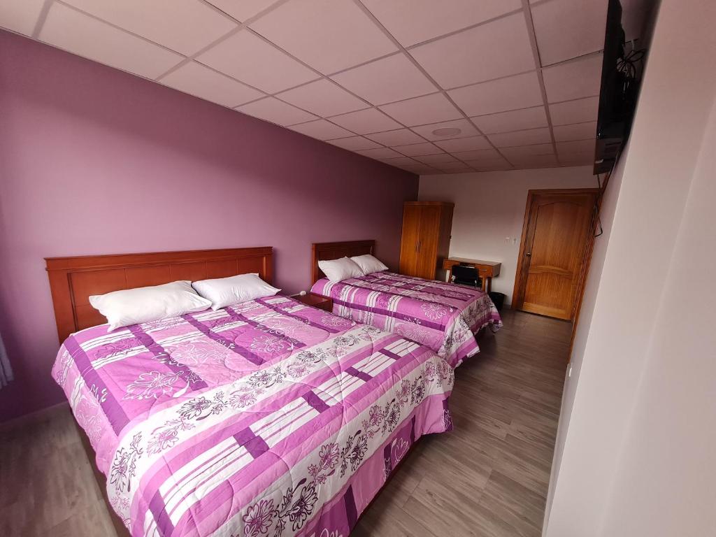 Postel nebo postele na pokoji v ubytování Hostal Morlaquita