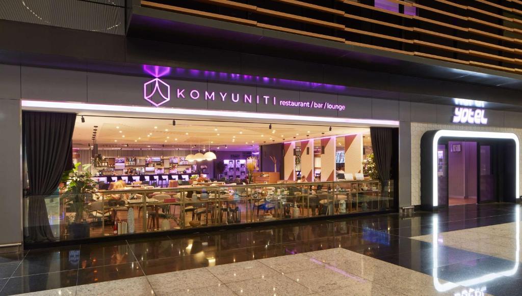 a store front of a shopping mall with a sign at YOTEL Istanbul Airport, City Entrance in Istanbul
