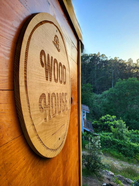 a wooden door with a wood shop sign on it at WoodHouse Near River - Near Ocean - Near Porto in Porto