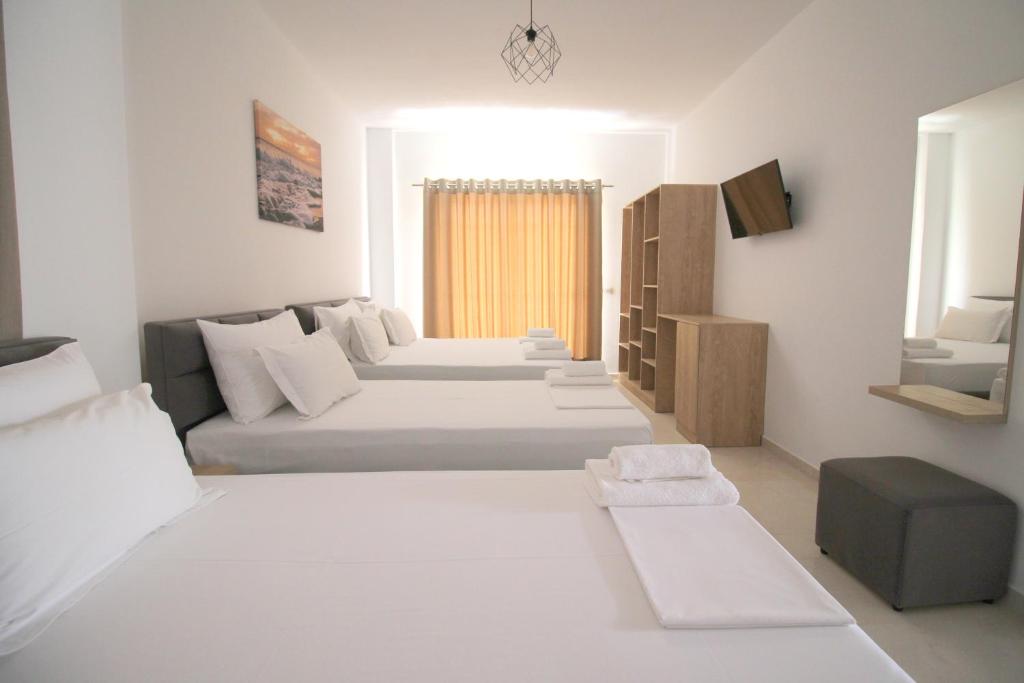 Postel nebo postele na pokoji v ubytování J&B Hotel
