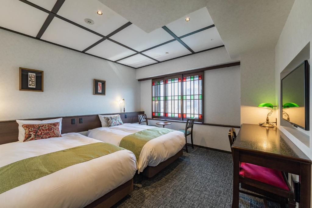 Postel nebo postele na pokoji v ubytování Hotel Aru Kyoto Sanjo Kiyamachi Do-ri
