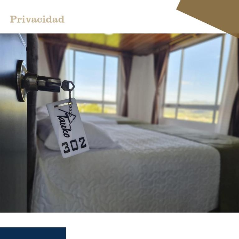 Postel nebo postele na pokoji v ubytování Tauko Tú Casa