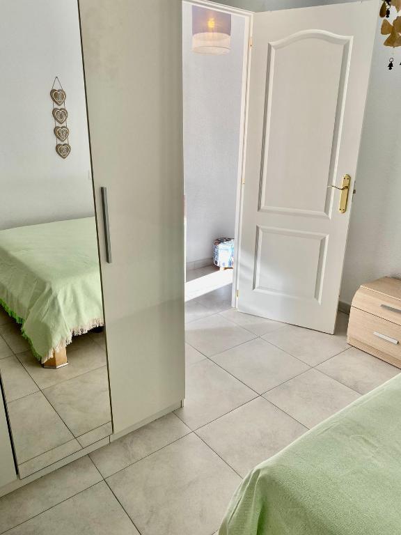 A bed or beds in a room at Apartment Santana -19 at Beach with Pool, Garage and Lift