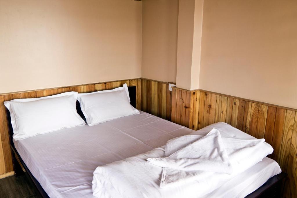 Postel nebo postele na pokoji v ubytování the DEW DROP HOME STAY