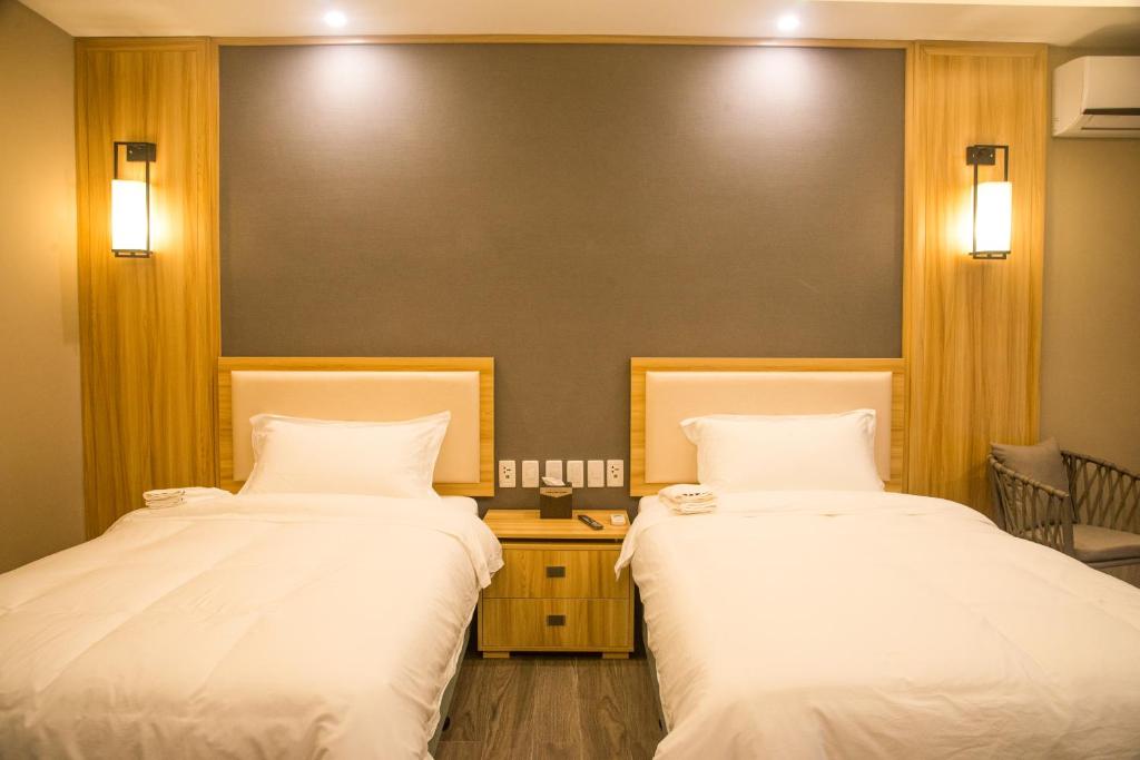 Postel nebo postele na pokoji v ubytování El Nido Garden Resort