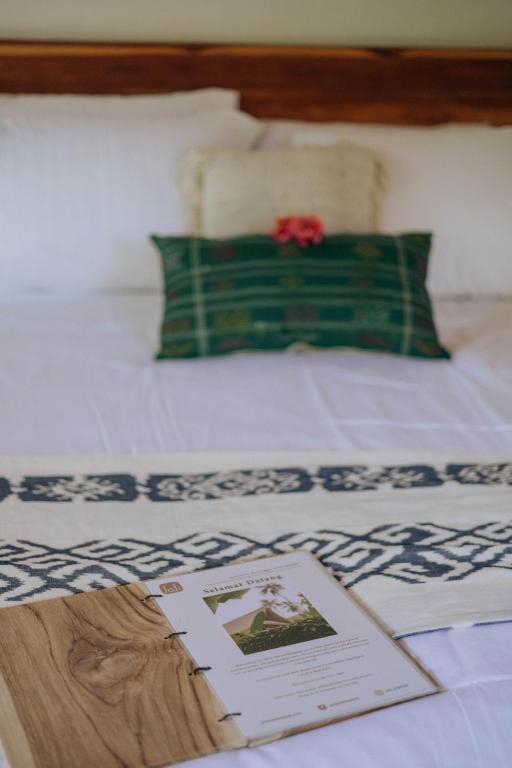 Postel nebo postele na pokoji v ubytování Jati Kuta Lombok