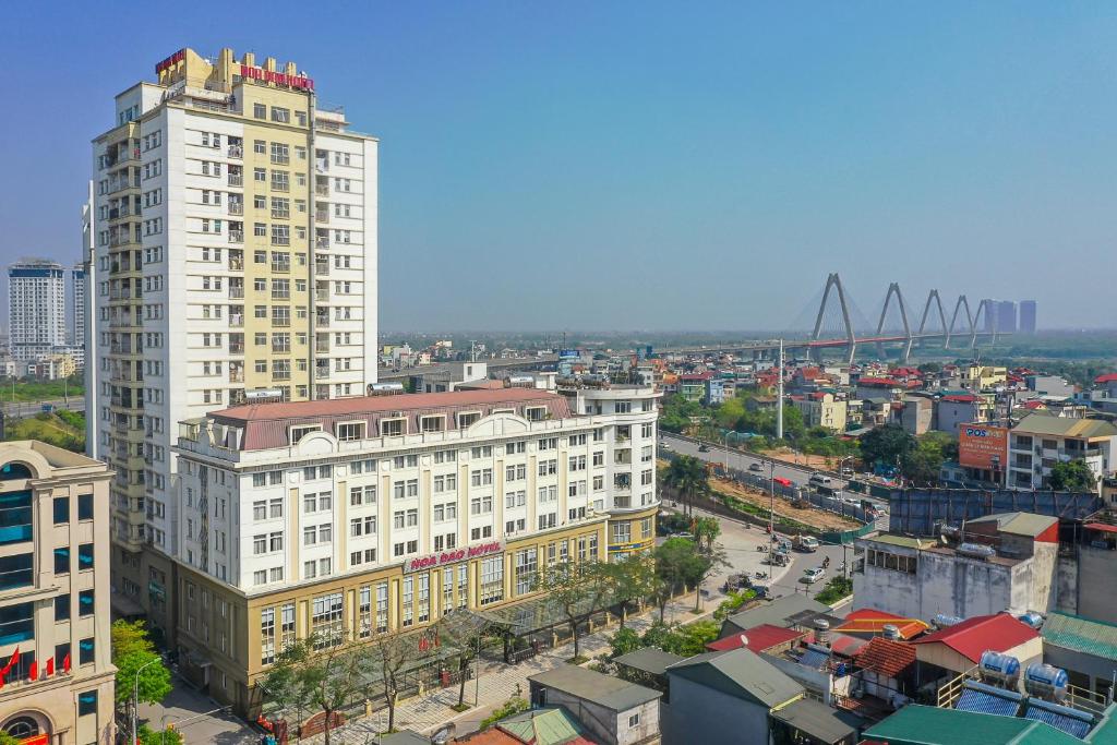 an aerial view of a city with a tall building at Hoa Dao Hotel in Hanoi