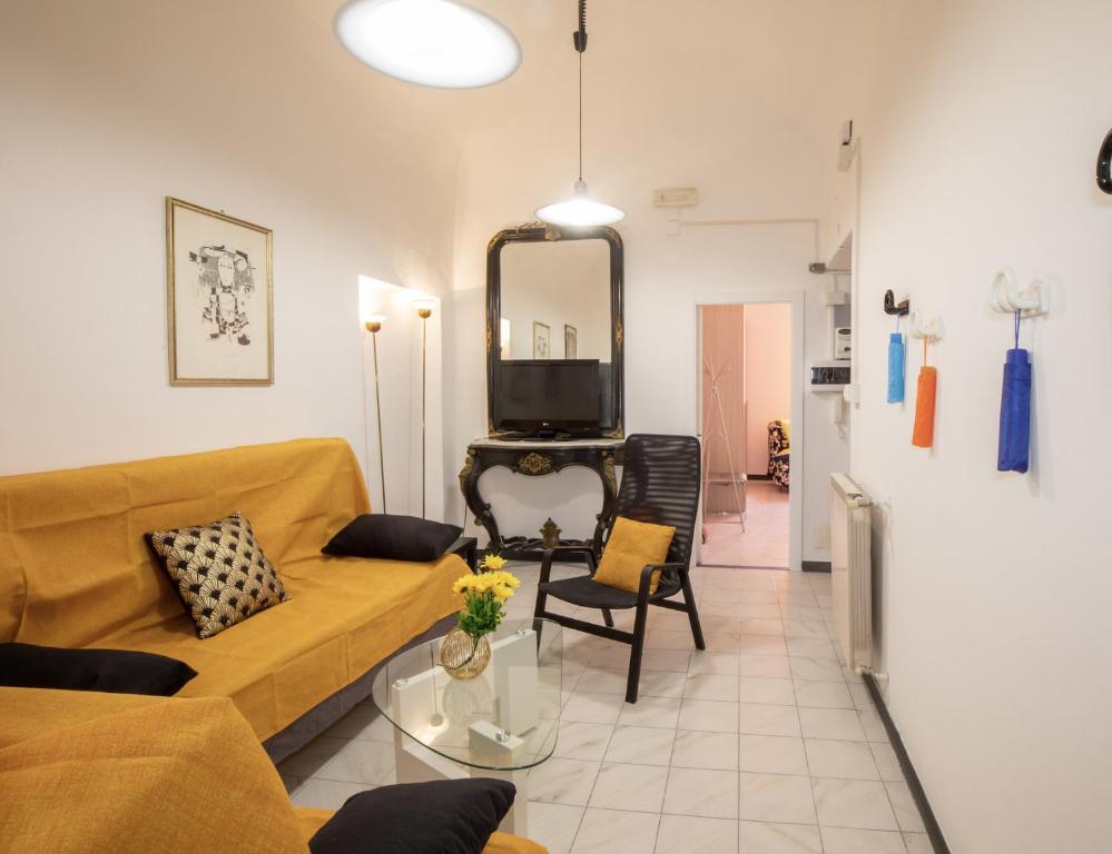 a living room with a couch and a table at Via Manzoni in Savona