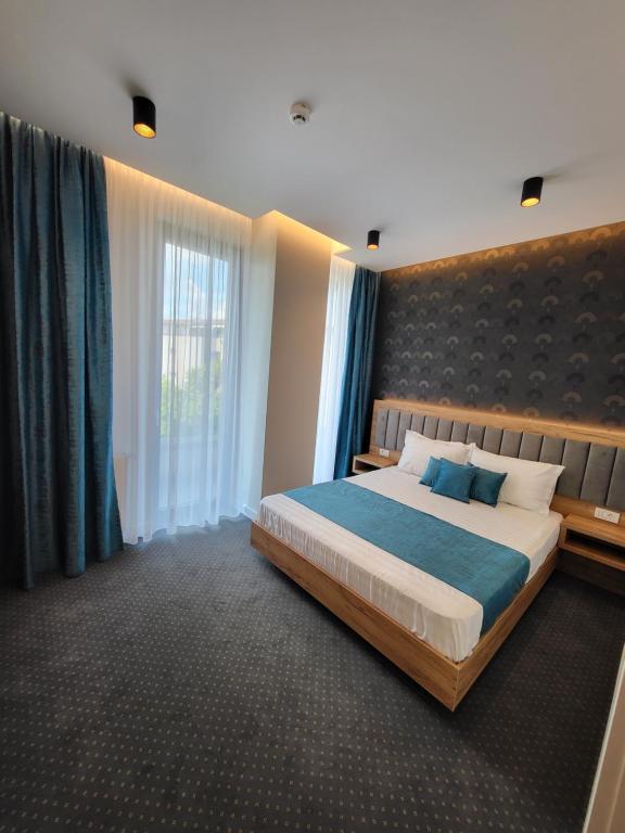 Postel nebo postele na pokoji v ubytování Hotel Excellence