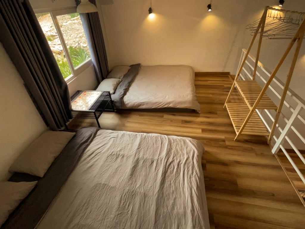 Postel nebo postele na pokoji v ubytování Dốc Garden Homestay Đà Lạt