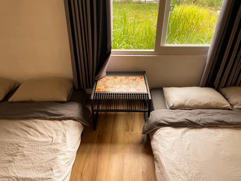Postel nebo postele na pokoji v ubytování Dốc Garden Homestay Đà Lạt