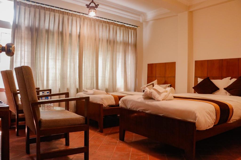 Postel nebo postele na pokoji v ubytování Hotel ThorongLa Thamel